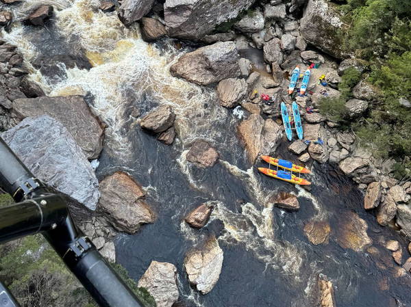 Kayaker in Tasmania has leg amputated after becoming 'wedged' between rocks in river