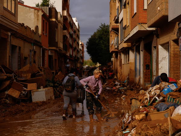 Heavy rains in Barcelona disrupt rail service as troops search for more flood victims in Valencia