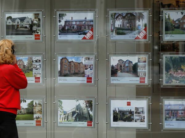 UK house prices hit record high but rise by least in 3 months, Halifax says