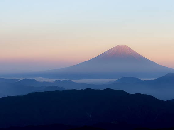 It’s not official yet but Mount Fuji gets its trademark snowcap after the longest delay in 130 years