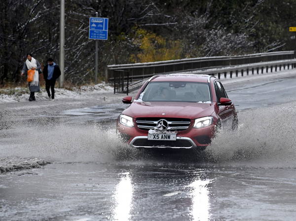 Heavy rain and thawing snow to bring floods as Storm Bert batters UK