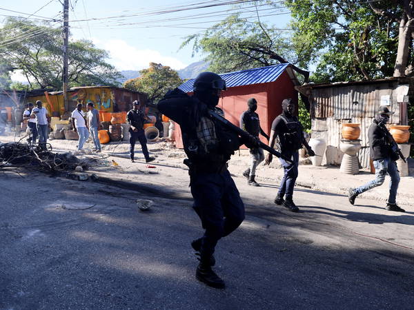 Residents in Haiti’s capital stand with police in a battle to repel the latest gang attack