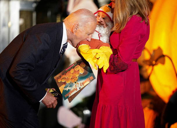 Biden, 81, bites baby dressed as chicken during WH Halloween event