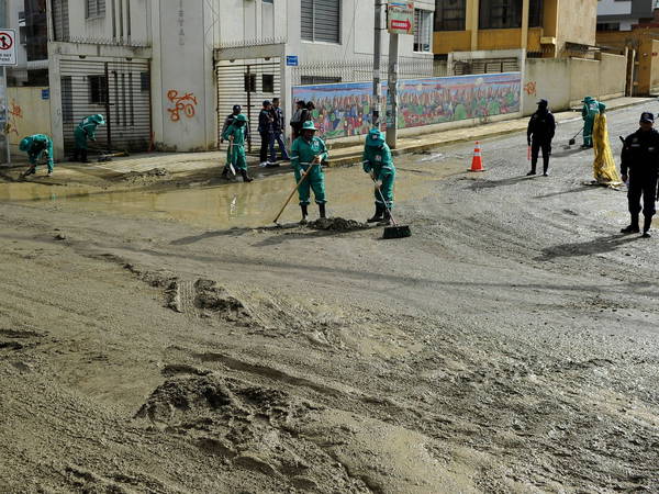 Heavy rains in Bolivia send mud crashing into the capital, leaving 1 missing and destroying homes