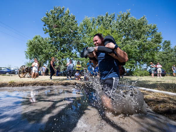 Mud, beer and cash: Annual wife-carrying championship takes Maine by storm