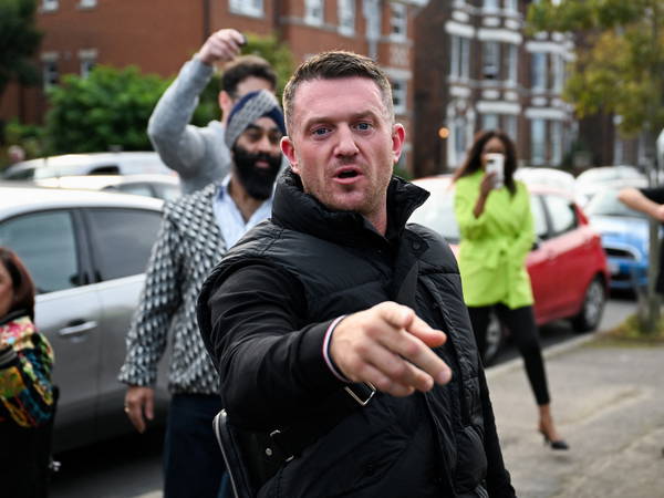 Thousands gather for Tommy Robinson’s protest as activist remains in custody.