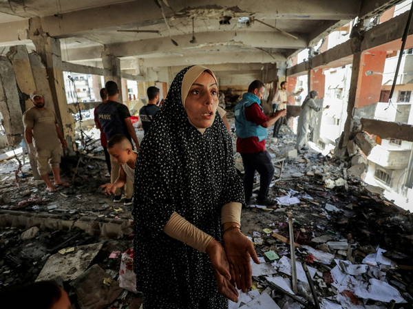 Palestinian officials say an Israeli strike on a Gaza shelter has killed at least 21 people